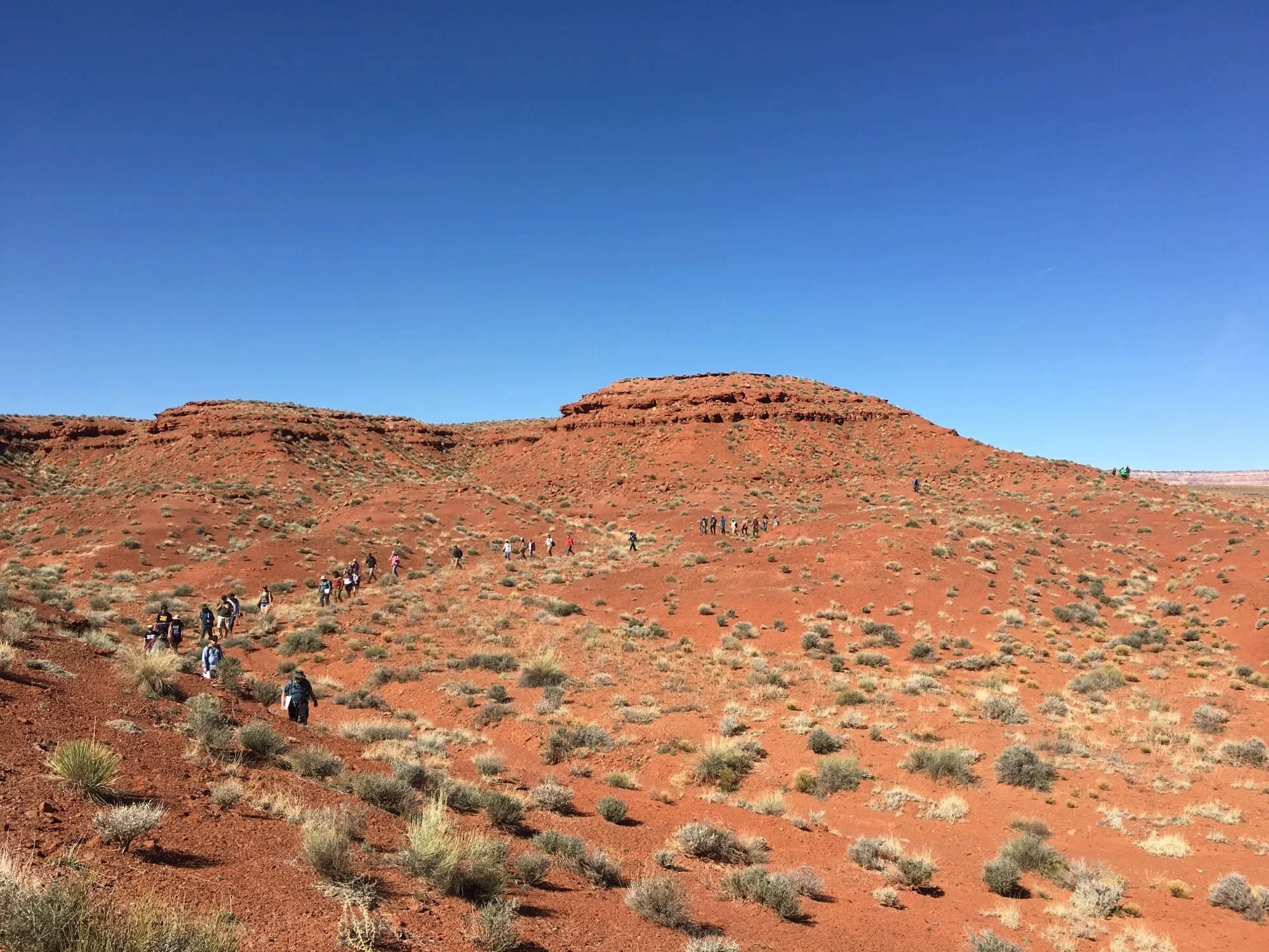 Students crossing red desert in Utah